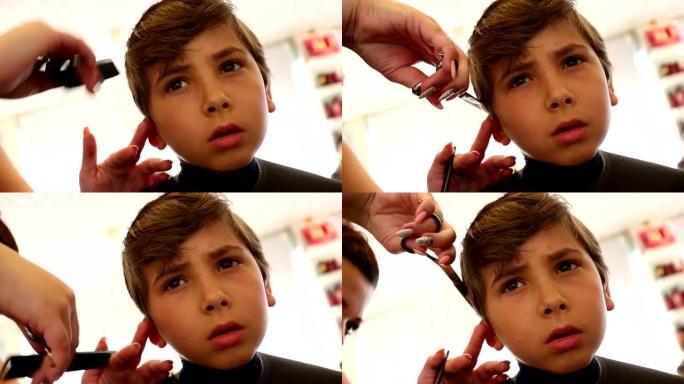 理发的孩子。8-10岁男孩在理发师理发
