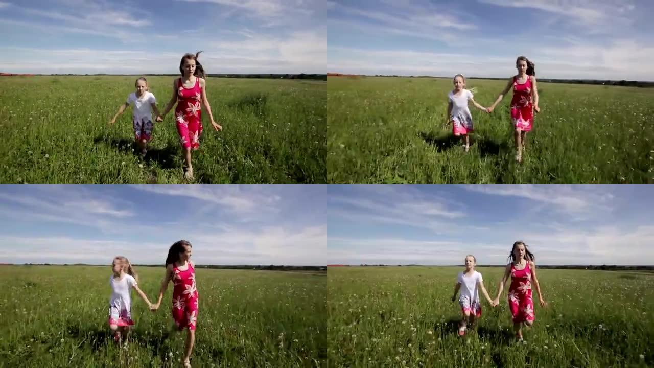 年轻女孩牵着手在田野里奔跑