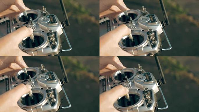 手握着控制FPV无人机的发射器
