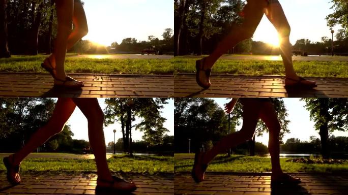 在夏季日落公园散步的凉鞋女孩的慢动作稳定镜头