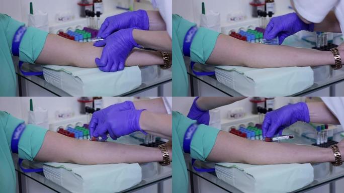 医生用红管从手臂上抽取血液样本