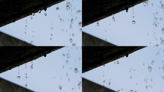 慢动作: 水滴从屋檐上掉下来