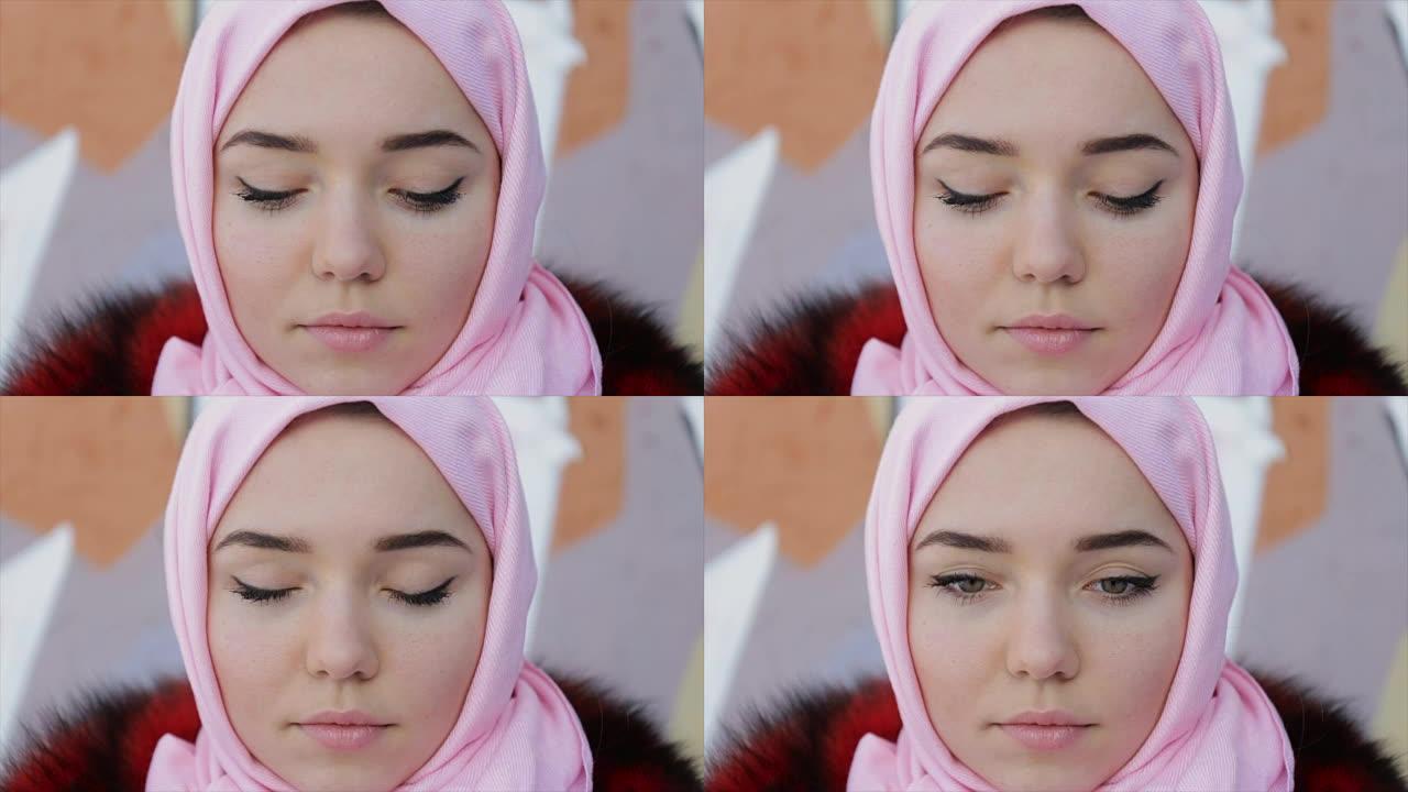 穆斯林妇女，头上盖着粉红色的围巾。全高清视频