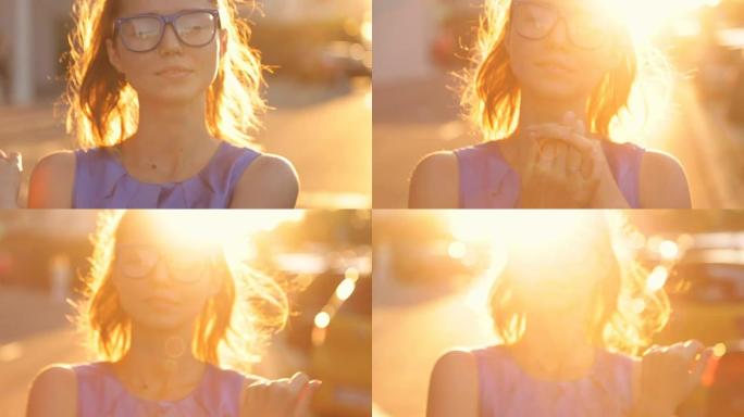 日落背景上戴眼镜的女孩