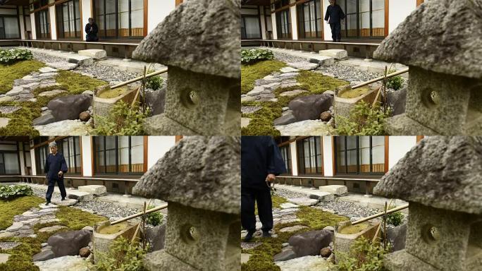 日本高级男子在寺庙祈祷