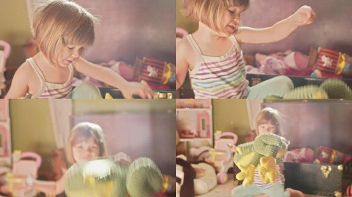 一个可爱的小女孩带着一勺花生酱让她的玩具青蛙跳来跳去