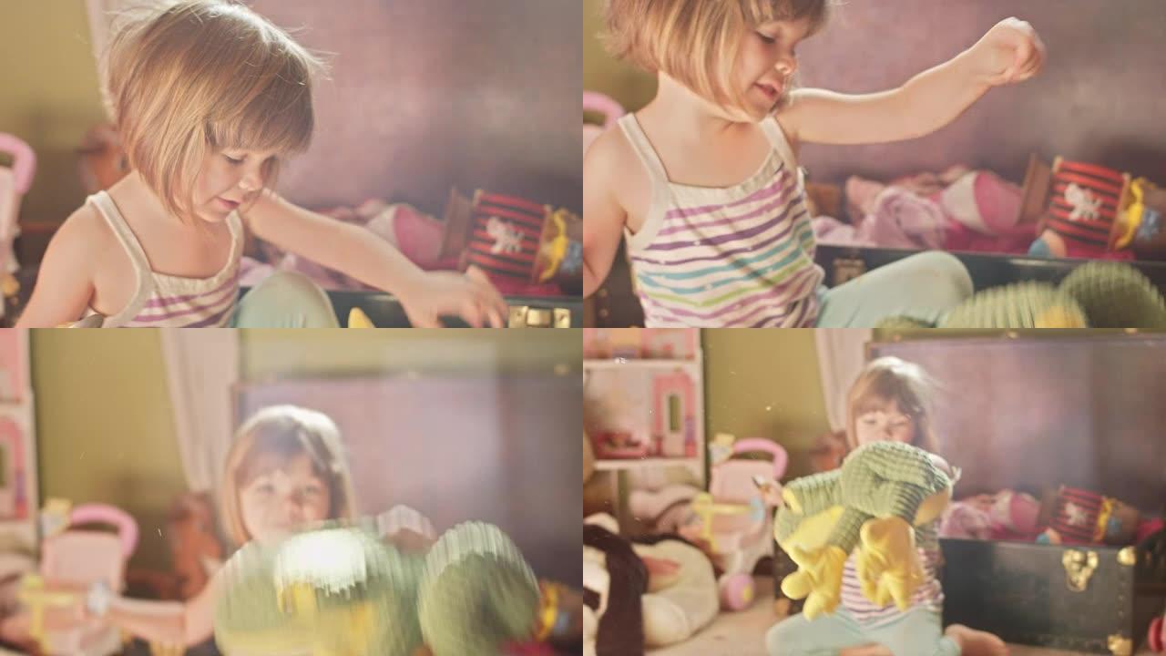 一个可爱的小女孩带着一勺花生酱让她的玩具青蛙跳来跳去