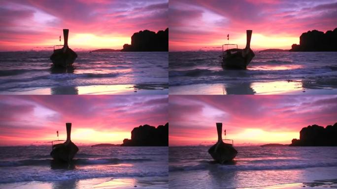 热带日落，泰国甲米传统长尾船铁路海滩的景色