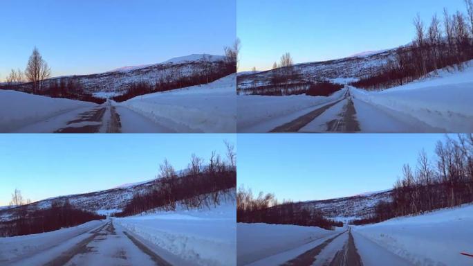 在挪威北部塞尼亚岛的一条曲折的冰冷道路上行驶