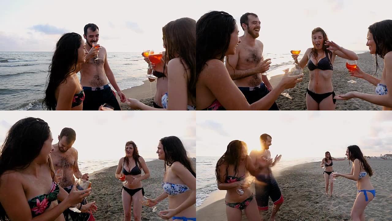 夏日无忧无虑: 年轻朋友在沙滩上敬酒