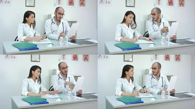 医生向他的女学员展示了如何在做笔记时阅读心电图