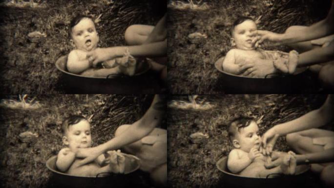 1936: 新生儿洗澡在户外的烹饪锅里洗。
