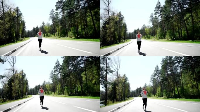 女子跑友在山地公路上慢跑训练马拉松。