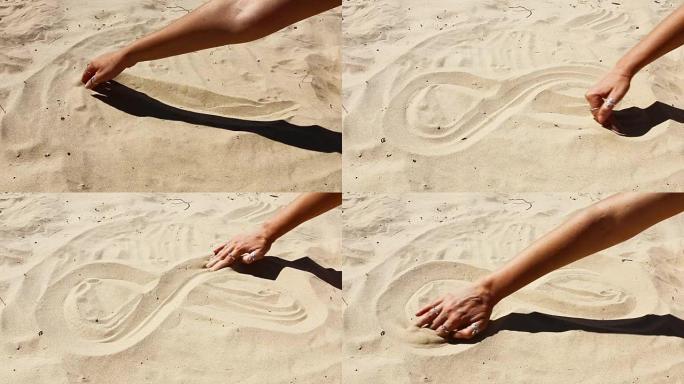 沙子游戏。女孩在沙子上画无限的标志
