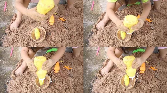 婴儿在户外玩沙子