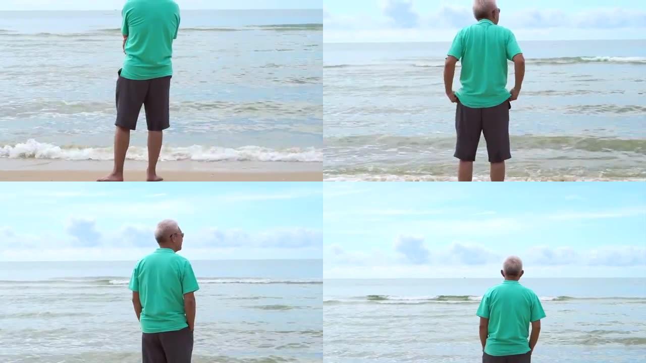 亚洲资深男子孤身站在海边思考人生