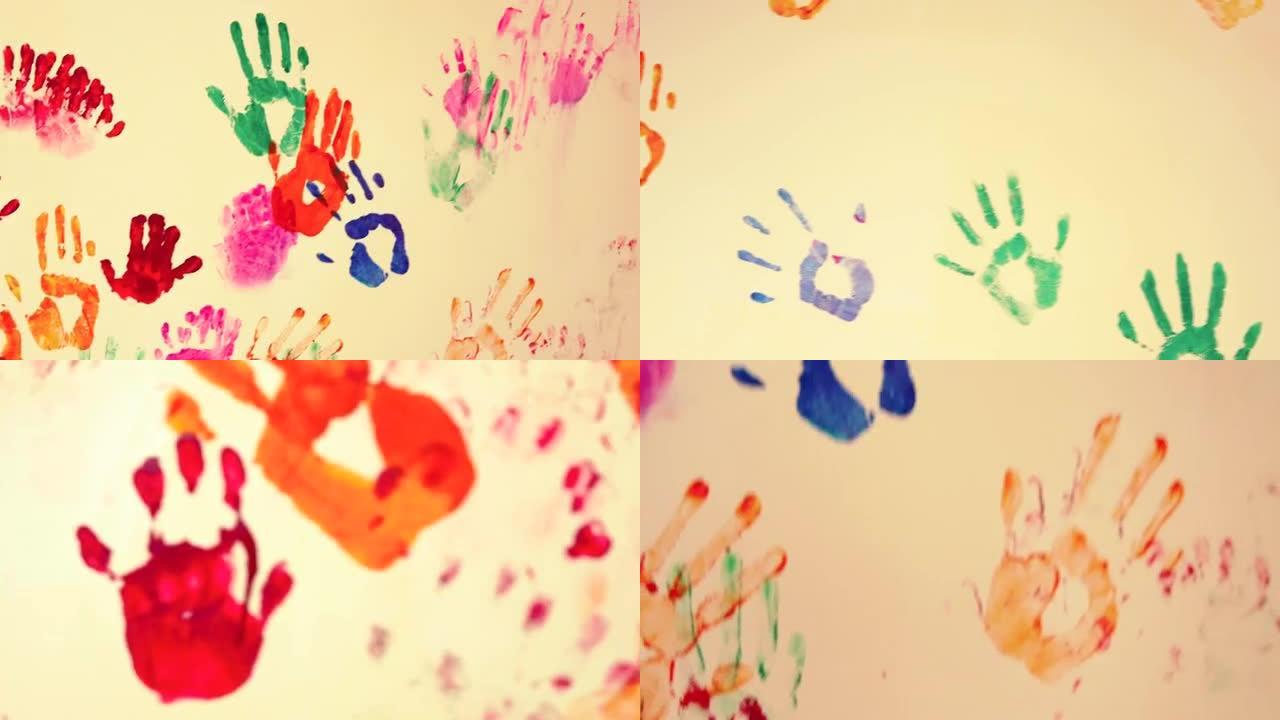 墙上画的彩色儿童手印的特写视图。4k镜头