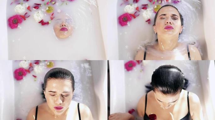 年轻女子在盛满鲜花的牛奶浴中沐浴，闭上眼睛起床的特写镜头。水疗和护肤概念。慢动作镜头