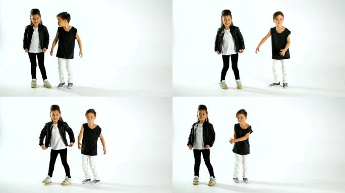 时髦的小孩跳舞，玩得开心，孤立在白色工作室拍摄
