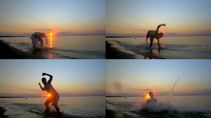 运动员在日落时在海滩上做杂技表演