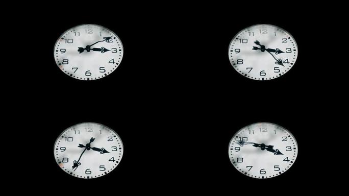 晚上大型冰冻城市钟。延时一小时。特写。纯黑色背景。