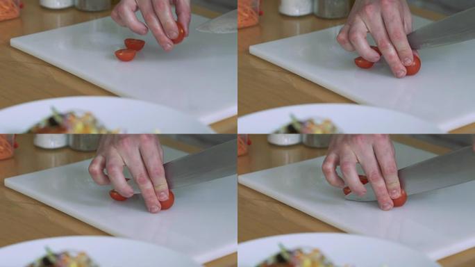 女人切西红柿-在餐厅厨房准备樱桃。慢慢地