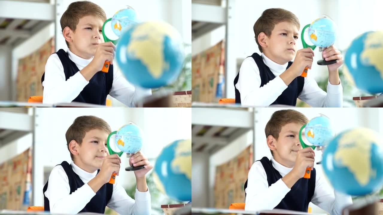 这个男孩用放大镜看着地球