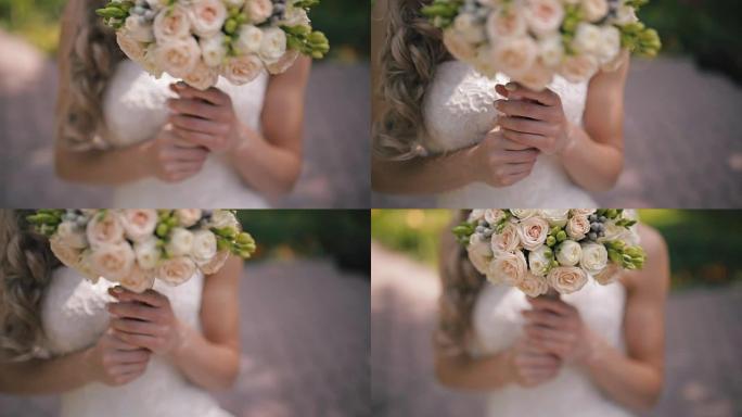 新娘拿着婚礼花束。