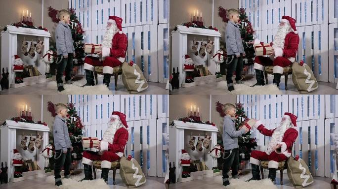 男孩是灰色盒子礼物圣诞老人，摇了摇耳朵