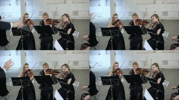 音乐家演奏小提琴的三位小提琴家