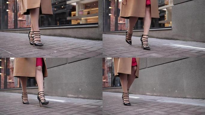 穿着高跟鞋走路的时尚女性