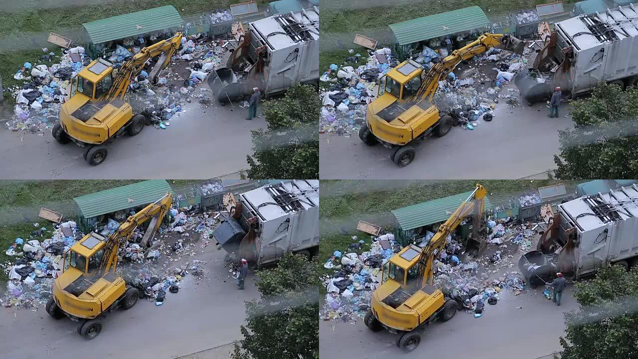 挖掘机清理街道上的巨大垃圾堆。