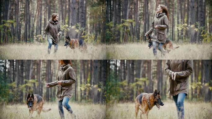 年轻女子与牧羊犬在秋天的森林中奔跑，慢动作
