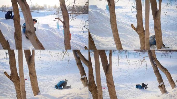 青少年在冬天在操场上玩耍。日落时在雪中翻转
