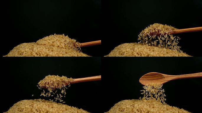 大米落在黑色背景下，慢动作4K