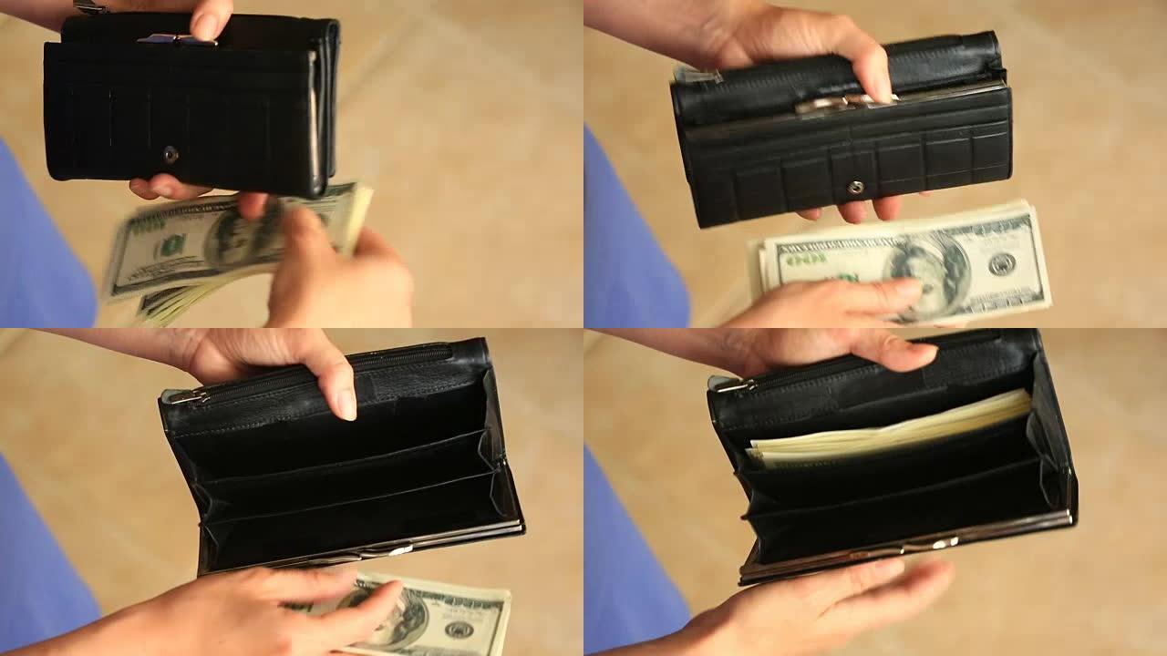 女人的手拿着一个带有美元的钱夹