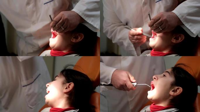 拔牙。牙医为一个小女孩拔牙