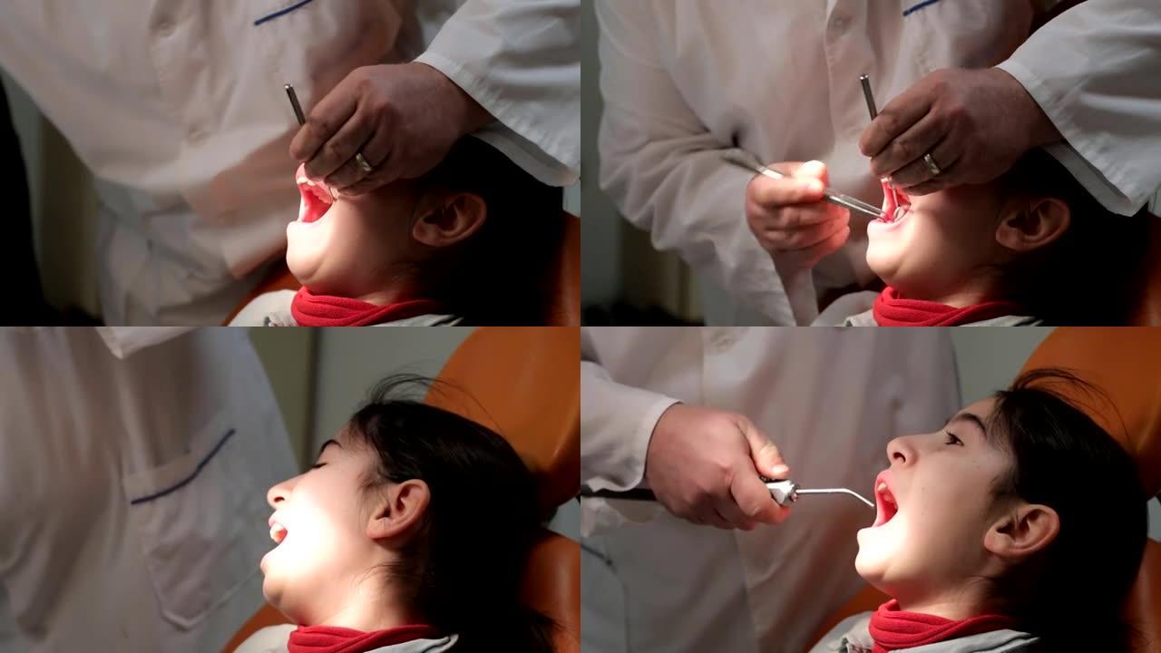拔牙。牙医为一个小女孩拔牙