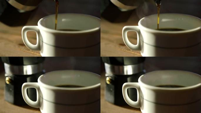 使用倒入白色杯子中的饮料的咖啡间歇泉准备一杯浓的新鲜冲泡的浓缩咖啡