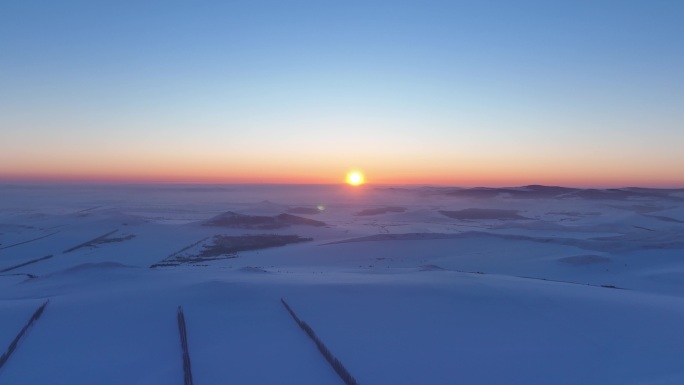 航拍4K东北垦区田野雪景落日