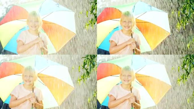 无忧无虑的女孩五年欢喜夏雨。站在彩色雨伞下