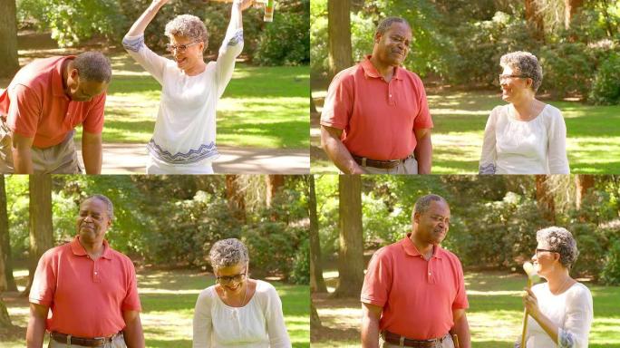 成熟的黑人妇女在公园玩槌球时庆祝