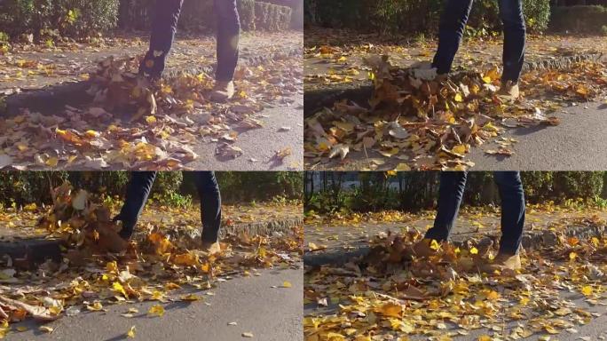 男人脚上穿着秋叶靴，走在落叶上