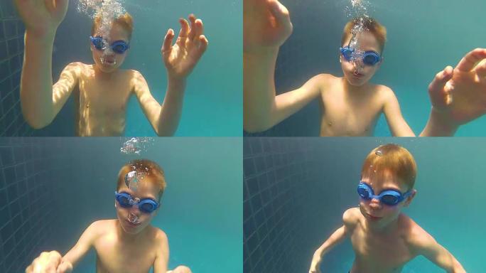 快乐的孩子在游泳池的水下尽情游泳