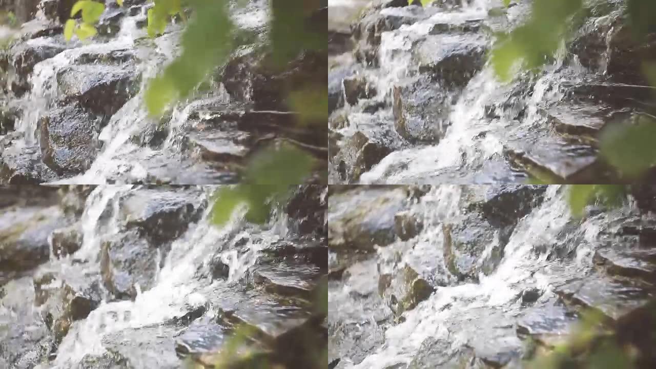 特写镜头水流向岩石