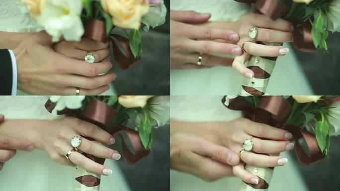 新郎手抚摸新娘，结婚戒指，鲜花，乌克兰