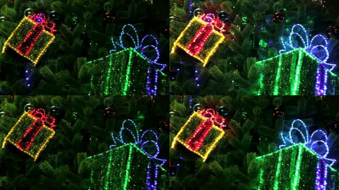 装饰圣诞树，带有闪烁的礼品盒和发光的灯