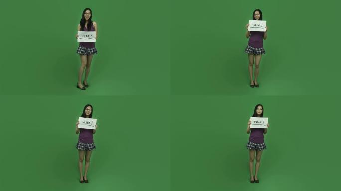 亚洲女学生孤立绿屏绿背景与投票签名