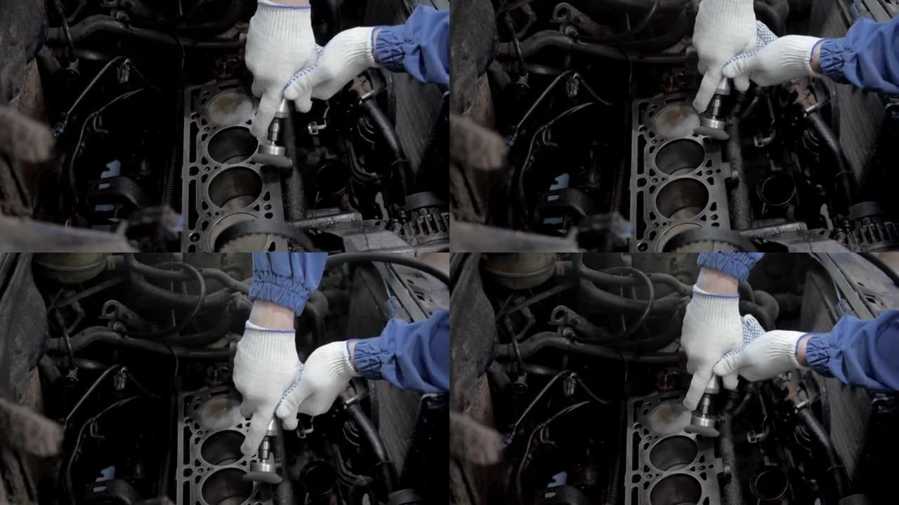 汽车修理工正在汽车修理厂研究发动机