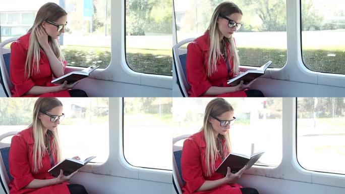 美女骑着电车，一边看书